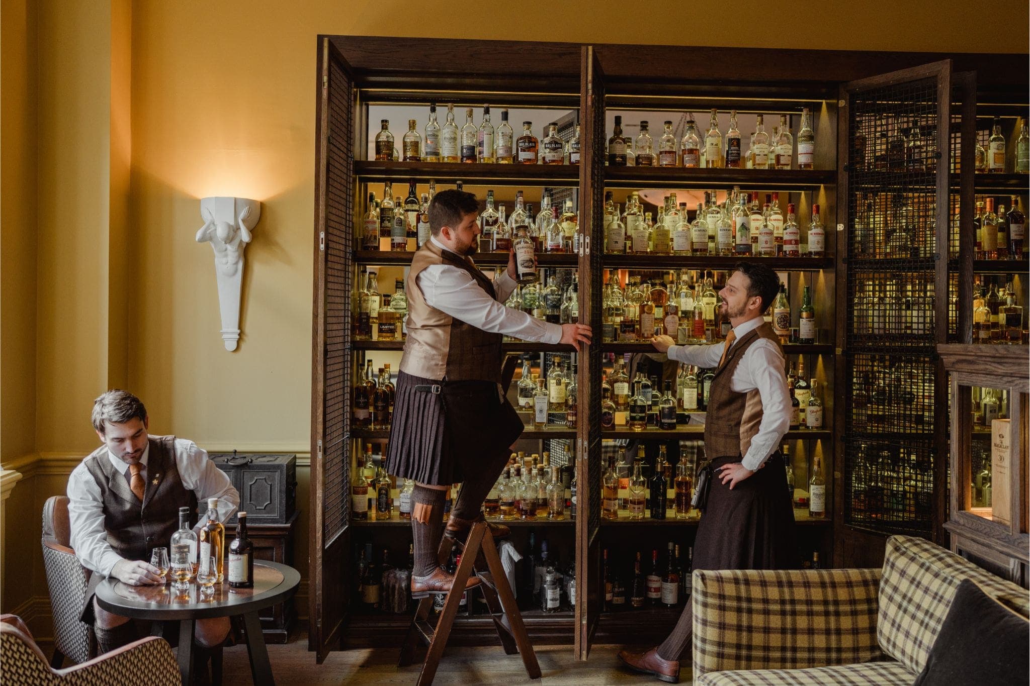 SCOTCH whisky bar at The Balmoral with glowing amber shelves of over 500 whiskies