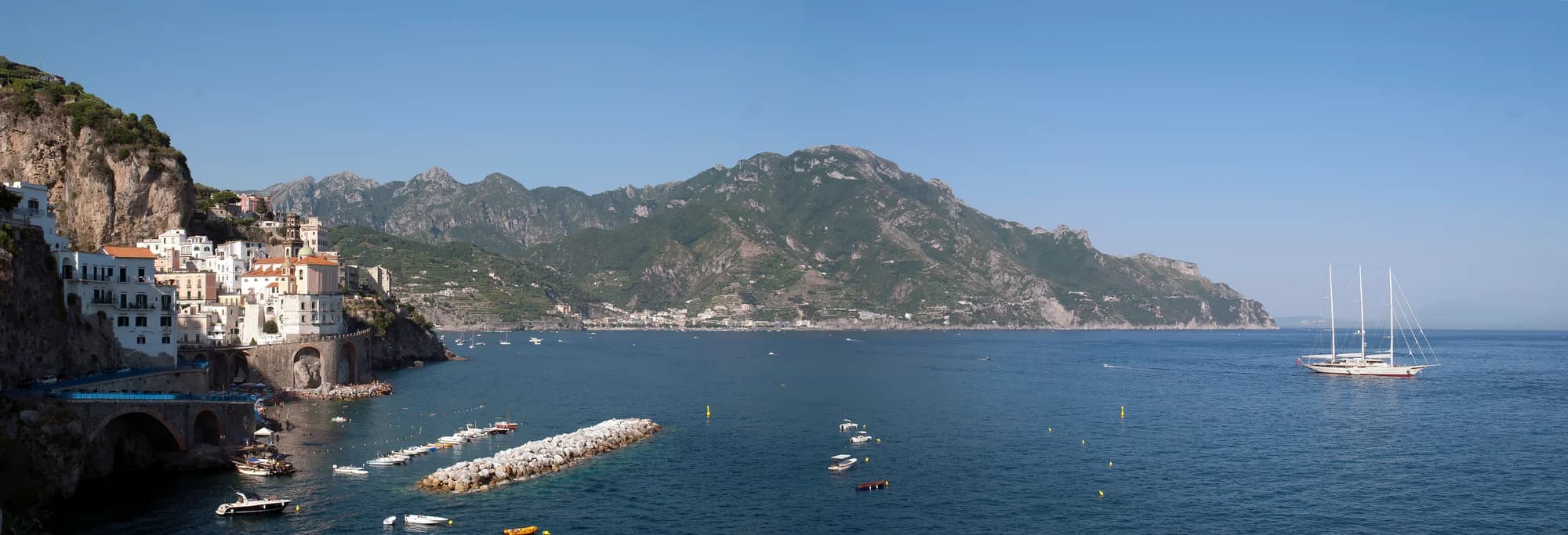 Fresh seafood spaghetti at a cliffside trattoria in Positano, with the sea beyond